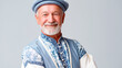 © Iryna - European senior man in traditional embroidered clothing with friendly smile and cultural heritage portrait concept