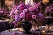 © AkuAku - Refined floral display of purple and pink flowers in a black vase suited for special occasions