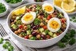 © Emin - Mixed bean salad with hard boiled egg halves and fresh herbs in lemon garnished bowls