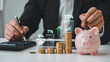 © picbox - Interest rate and dividend concept, Businessman is calculating income and return on investment in percentage. income, return, retirement, compensation fund, investment, dividend tax, stock market
