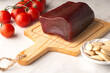 © uliab - La moixama. Mojama or Mosciame, Spanish and Sicilian dried tuna served with tomatoes, almonds, and olive oil. A gourmet dried fish