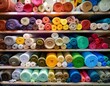© Susanne - rolls of colourful fabric in fabric store
