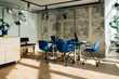 © Maskot - Modern office interior with blue chairs and glass meeting table