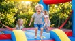 © Masque - Happy children laughing and jumping inside a colorful inflatable bounce house.