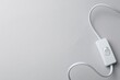 © New Africa - Cord switch for lamp on light grey background, top view. Space for text