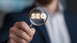 © A2Z AI  - Professional holds magnifying glass highlighting essential digital marketing abbreviation, symbolizing detailed search, analysis, and discovery of information