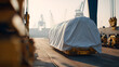 © A2Z AI  - Large cargo covered with white tarp on transport cart, ready for shipment at an industrial port with cranes under bright sky