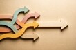 © Leo Rohmann - Colorful arrows diverging on beige background representing choice direction and decision making