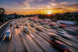 © YUTO PHOTOGRAPHER - 夕暮れの高速道路を走る車の光跡