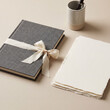 © Sekai - Linen-bound notebook with silk ribbon deckled paper stack minimalist luxury stationery professional product photography
