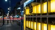 © Ariestia - Battery swapping station illuminates the sidewalk at night.