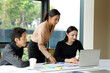 © Tanison - A group of multi-ethnic young professionals, aged 20-30, working together around a laptop in a bright office with large windows. The images show brainstorming, teamwork, celebration, and success in a