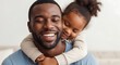 © Color Zoo - Happy father hugging his little daughter at home