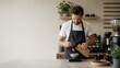 © stasja - barista weighing coffee beans  in modern kitchen