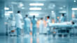 © CStock - Blurred scene of healthcare professionals in a hospital, emphasizing teamwork and dedication in patient care.