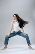 © wedmoments.stock - Beautiful young fashion model posing in casual outfit on isolated background. Concept modern style, confidence and commercial fashion.