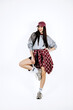 © wedmoments.stock - Young woman in urban retro fashion style posing on isolated white background. Concept youth trends and confidence.