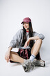 © wedmoments.stock - Stylish female model in casual fashion-forward look on isolated background. Concept modern wardrobe and self expression.