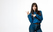 © wedmoments.stock - Stylish woman pointing to the side while posing on white backdrop. Concept recommendation and commercial presentation.