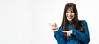 © wedmoments.stock - Young woman pointing sideways with hands on isolated white background. Concept direction, information and promotion.