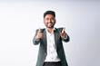 © PRASANNAPIX - young indian businessman standing on white background