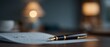 © progressman - Close-up of fountain pen on written note with warm lamp lights behind