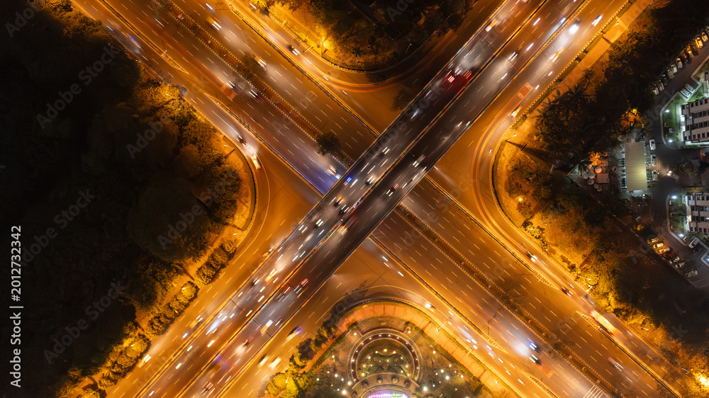 Top View Aerial of Busy Highway Interchange at Night with Light Trails ...