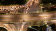 © Creativa Images - Aerial Top View of Busy City Traffic Jam and Light Trails on Flyover at Night