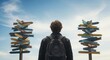 © SadiyaAnjum - Young man with a backpack standing in front of two signposts with many directions