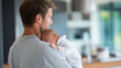 © Nataliya - Rear view of a father on paternity leave holding a newborn baby at home, involved parenting concept, new father and infant, family lifestyle photography, defocused background,