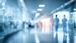 © Subin - Blurred view of hospital corridor with healthcare professionals walking, symbolizing the healthcare environment.