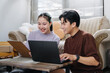 © อภิสิทธิ์ ปักเหนือ - Excited Asian Couple Laughing at Laptop Screen, Online Business Achievement Concept