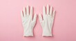 © Ahmad - Pair of White Medical Gloves on Pink Background, Cleanliness and Hygiene Concept