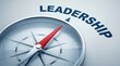 © Wajahat - Leadership concept with compass pointing direction on gray background with red needle