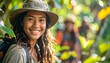 © Desain - Smiling woman in green forest environment.