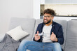 © nazariykarkhut - Frustrated man losing playing video game at home