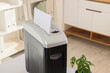 © Pixel-Shot - Shredder with paper sheet in modern office