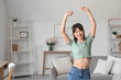 © Pixel-Shot - Portrait of smiling young woman at home