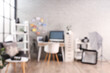 © Pixel-Shot - Blurred view of office with photographer's workplace, professional equipment and shelf units