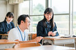 © buritora - A teacher and a female student using smartphones during class (BYOD/ICT)
