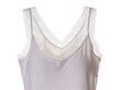 © Andrei - Isolated elegant light pink sleeveless camisole top with delicate white lace trim