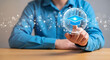 © Mizanby - Human Hand Activating Digital Education Concept with Glowing Graduation Cap Icon and Network Connections