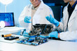 © Nuttapong punna - Showcasing expert computer hardware assembly and hard drive installation with precision and advanced technology for IT and electronics enthusiasts.