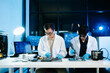 © Nuttapong punna - Asian engineers and scientists working with computer hardware, AI systems and digital technology