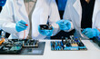 © Nuttapong punna - The technician is putting the CPU on the socket of the computer motherboard. electronic engineering electronic repair, electronics measuring
