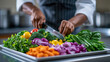 © Nattapol - Focused professional chef chopping fresh colorful vegetable ingredient with sharp knife on cutting board preparing healthy meal in kitchen