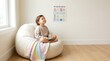 © Shubha Roy - Child relaxing on bean bag chair during calm sensory break time