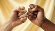 © adobe online - Two fists bump together in a sign of unity and friendship and togetherness.