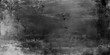 © hossain - A dark vintage black and white grunge background features a textured stone wall pattern with old gray concrete and nature elements like snow and trees for a weathered paper design