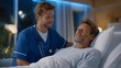 © Tania - Night-shift caregiver replacing saline drip beside sleeping veteran patient, only blue monitor light illuminating both faces, stethoscope still around neck, fatigue visible in posture, ideal for